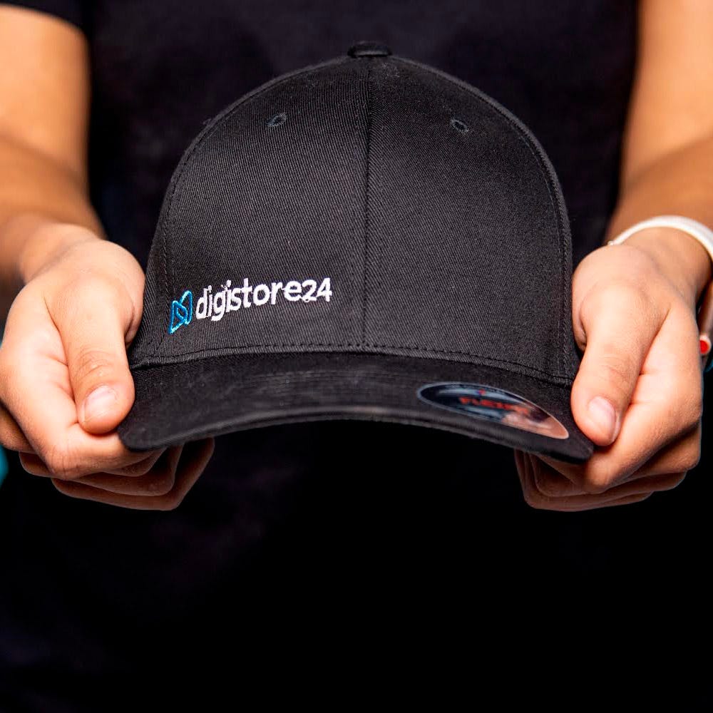 A close up of a black Digistore24 branded baseball hat.