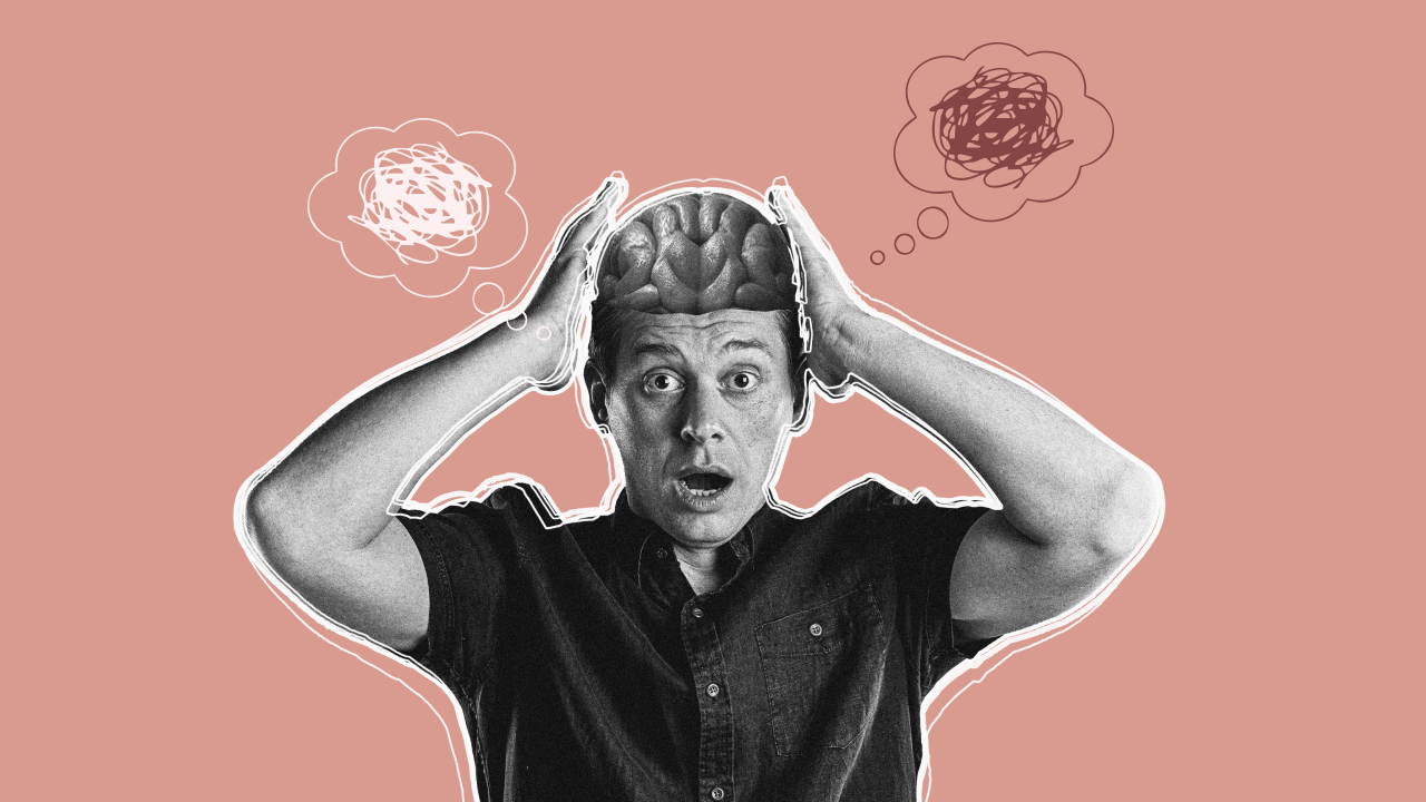 Ein Mann greift sich verzweifelt an den Kopf